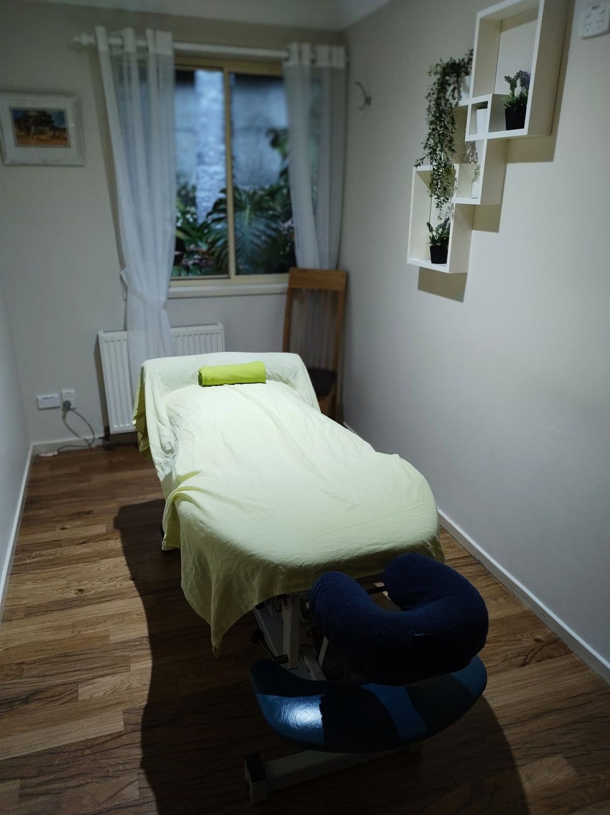 A massage table made up in a treatment room